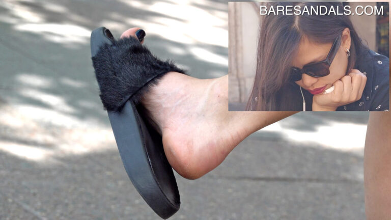 Asian woman dangling furry slippers - video update 13121