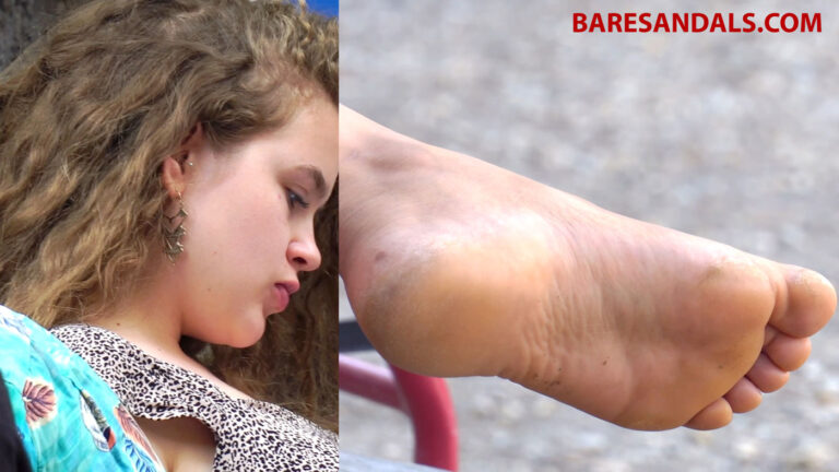 Curly-haired girl showing her soles as they slide out of her Birkenstock sandals