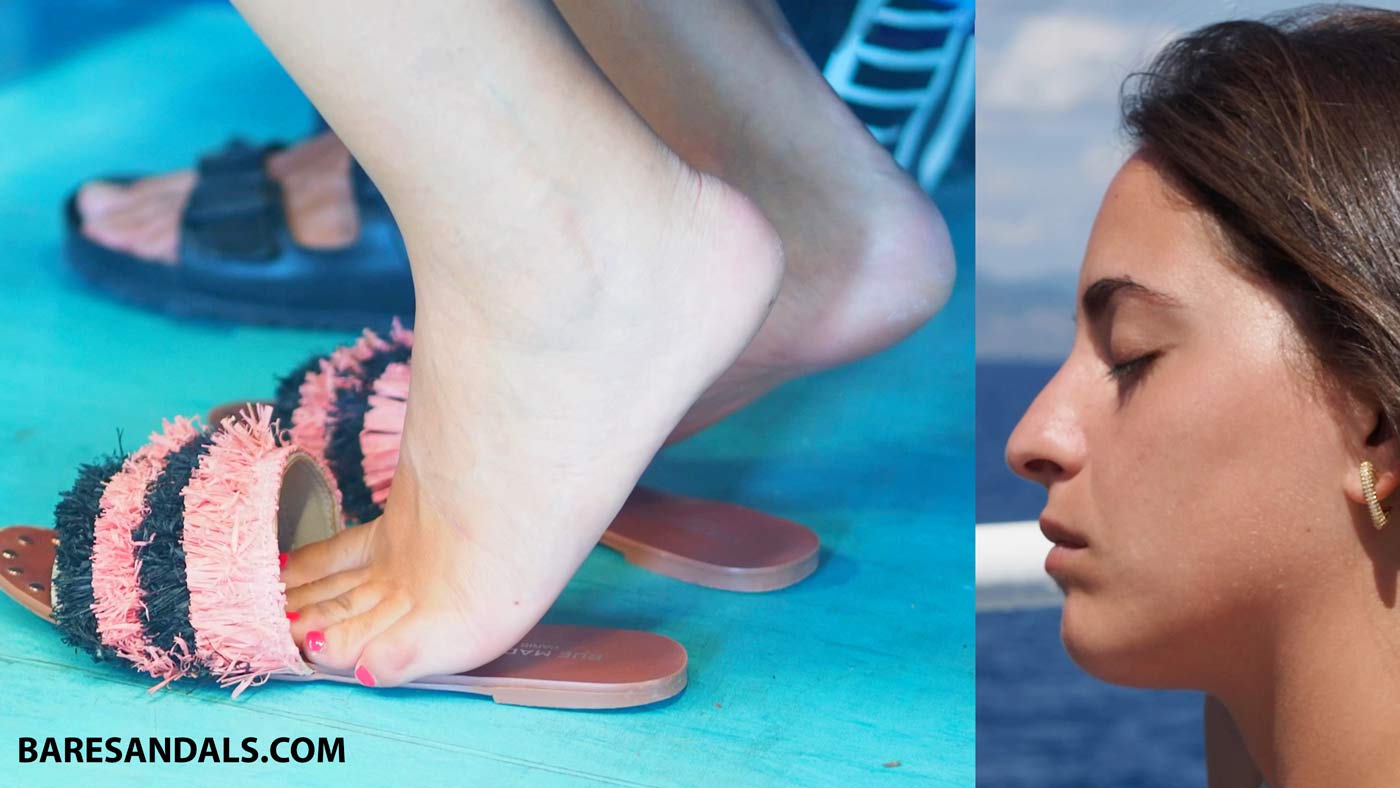 13186 – Candid video update of an Italian woman sitting in a boat wearing flat sandals